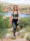 woman hiking in a camo flag sports bra and matching compression leggings at the watson lake park in prescott arizona