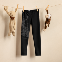  Kids leggings with a red stag deer on them in black. Hanging on a clothing line