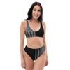 woman wearing a high waist patriotic bikini from River to Ridge Clothing Brand, grey and black USA flag