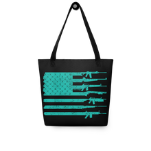  River to Ridge tote bag in black and teal with gun logos on it