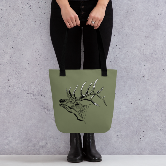 Elk Logo Tote Bag from River to Ridge Clothing Brand featuring a bugling elk with large antlers on an olive green bag - woman in black holding the purse