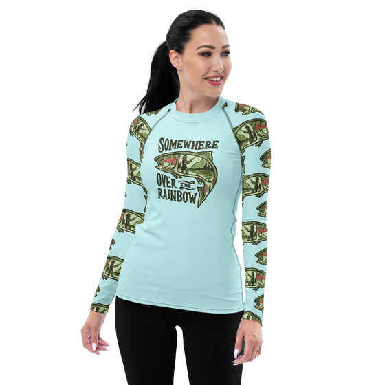 woman wearing a somewhere over the rainbow trout fishing shirt. upf rash guard. Woman has on black pants and long dark hair (shirt from River to Ridge Clothing Brand)