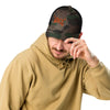 camo hat on a guy with a beard and it has the elk antler logo wild