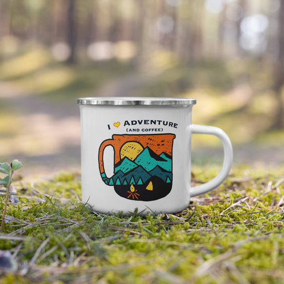 I love adventure and coffee logo printed on a metal camping coffee cup sitting in the moss from the Brand River to Ridge