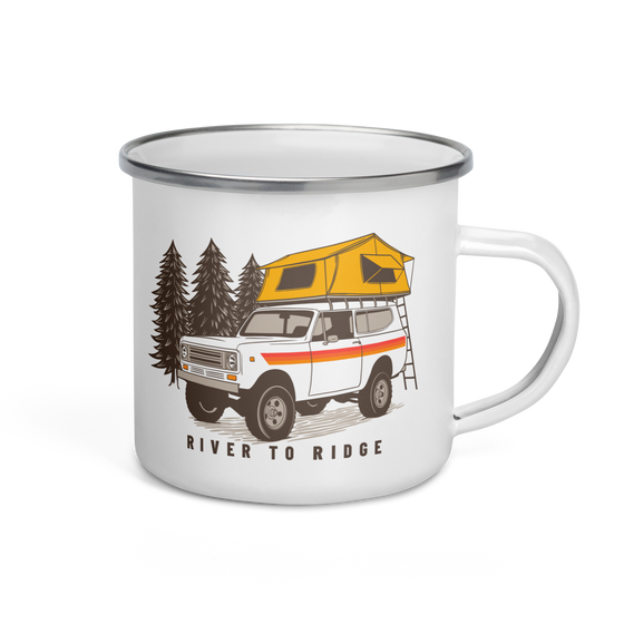 Enamel coffee mug from River to Ridge Clothing Brand with a vintage scout truck on with a tent on top camping in the forest