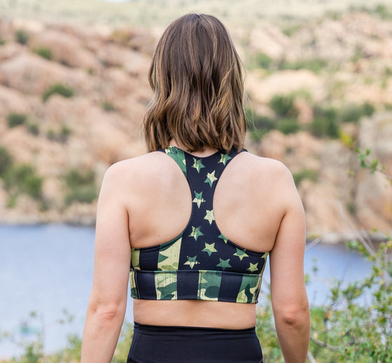 woman in a t back sport bra with the camo flag pattern on it at watson lake arizona