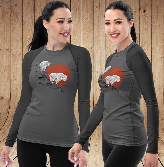Mountain Goat UPF 50 Rashguard Sun Shirt in shades of grey with 2 mountain goats on a cliff and a red sun - two views of a woman wearing it