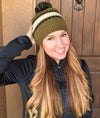 Diamond Ripple Knit Beanie with Pom Pom on Woman with red hair. Hat is olive green and ivory