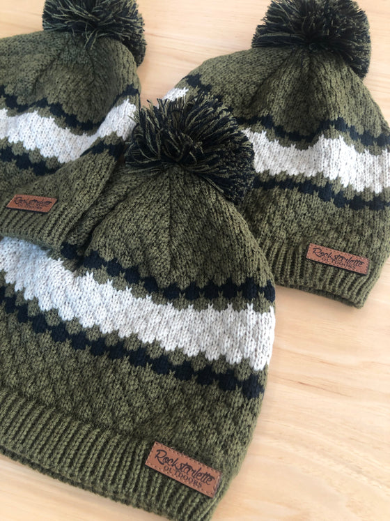 Diamond ripple cable knit hat with leather patched etched with Rockstarlette Outdoors. Hat is olive black and white