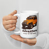 Adventure from the River to the Ridge Logo Coffee Mug with a landcruiser truck in yellow on it with big tires
