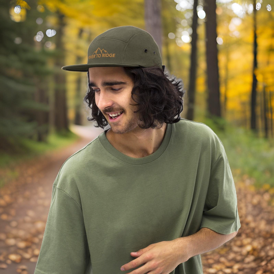 Man wearing a retro vintage classic Camp Hat in Olive from River to Ridge Clothing Brand