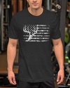 man at the gym wearing a black t shirt with a camo flag on it and a whitetail buck deer skull and antlers