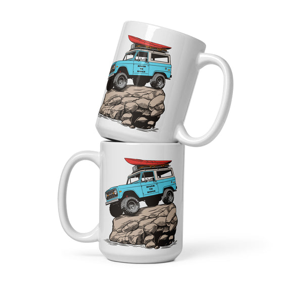 River to Ridge brand coffee mugs stacked on top of each other. Featuring a bronco on top of a rock in vintage blue and the truck has a red kayak on top of it