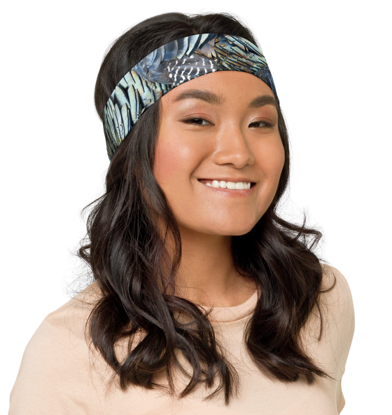 Woman wearing a turkey feather pattern headband with long hair. From River to Ridge Brand