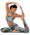 Woman doing yoga post wearing turkey feather pattern activewear set with sports bra and leggings