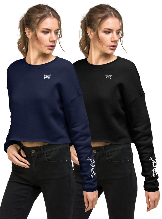 2 women in cropped sweatshirts in black and blue that have WILD elk antler logo on them