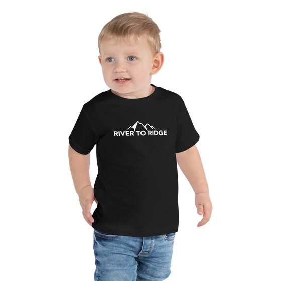Little boy wearing a river to ridge brand logo t shirt in black