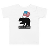 Patriotic Bear Logo from River to Ridge Brand on a toddler t shirt for kids in white. Features a black bear holding a USA flag