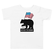  Patriotic Bear Logo from River to Ridge Brand on a toddler t shirt for kids in white. Features a black bear holding a USA flag