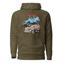  Womans hoodie in olive from the Brand River to Ridge. Features a drawing of a bronco truck, vintage blue on a rock with big tires and a red kayak on the top