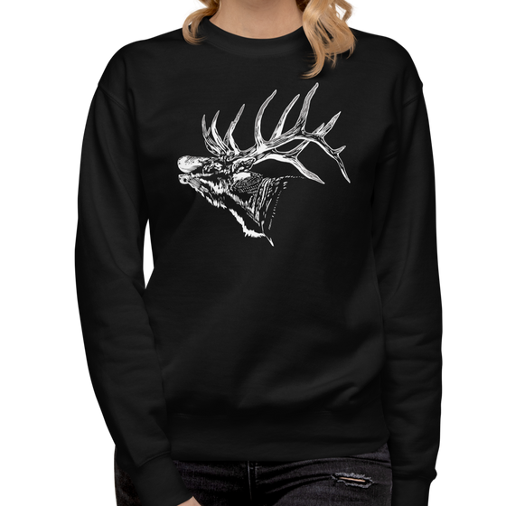 Woman with blonde hair wearing a black sweatshirt with an elk in white bugling with big antlers and jeans