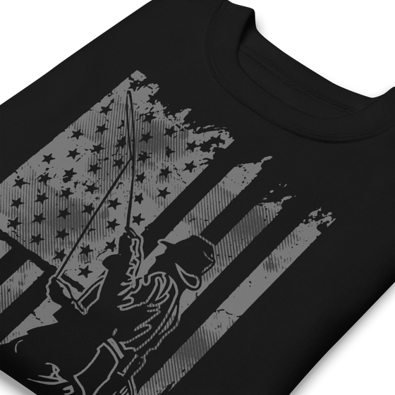 Men's Fishing USA logo on a black sweatshirt from the Brand River to Ridge Clothing, featuring a man fly fishing in a river with the USA American flag in the background