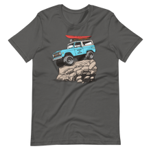  Womens offroading classic t shirt in grey from River to Ridge Clothing brand featuring a bronco truck with big tires up on a rock with a red kayak on top