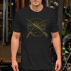 Man wearing a hunting and fishing logo t shirt in heather black at the gym with a rifle and a fishing pole on it from River to Ridge Clothing brand