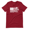 Sportsmans Flag shirt from river to ridge brand that has a USA flag along with a man fishing for bass in a kayak and a goose, a fly fishing pole and elk shed antlers in the flag stripes in red and white