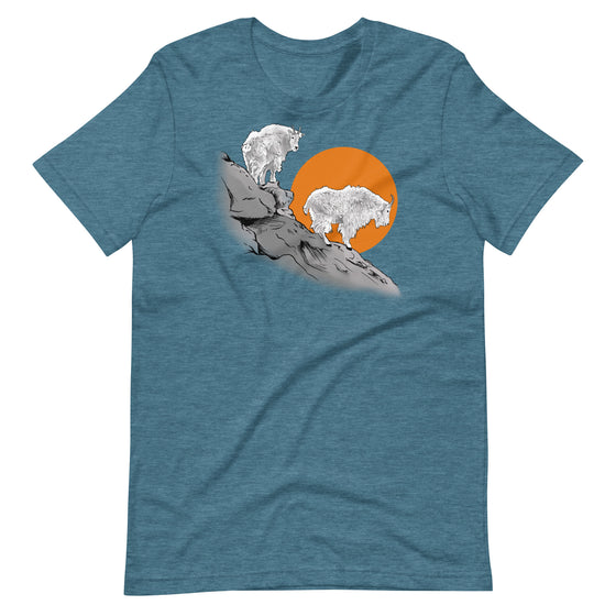 teal blue t shirt with 2 mountain goats standing on a ledge in the setting sun