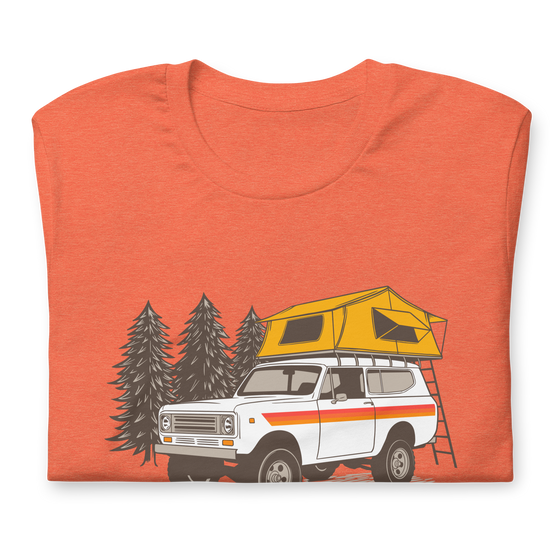 Womens offroad t from River to Ridge Clothing Brand featuring a vintage scout truck with a tent on top camping in the forest