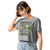 woman looking down wearing a trout fishing crop top and high waist jeans. the T shirt says somewhere over the rainbow with a trout on it and a lady angler