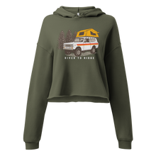  Vintage Truck Camping Logo with a Scout and a tent on top on a cropped hoodie from River to Ridge Brand for women
