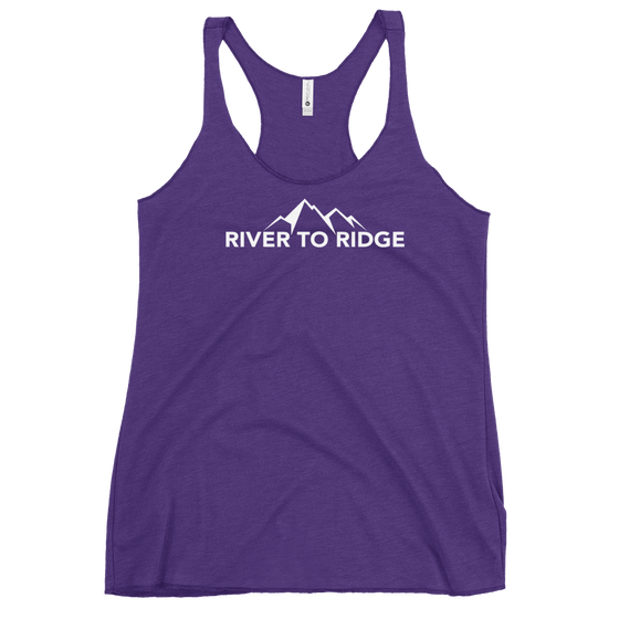 Womans tank top in purple with the River to Ridge logo brand on it with mountains in white