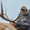 Person posing with a large elk