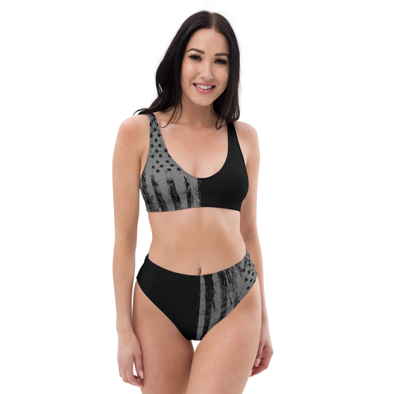 woman wearing a high waist patriotic bikini from River to Ridge Clothing Brand, grey and black USA flag