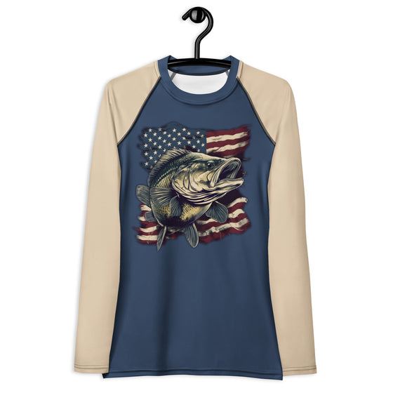 Product mockup of a Bass Fishing UPF 50 women's rash guard shirt in blue and beige with a bass over the USA flag