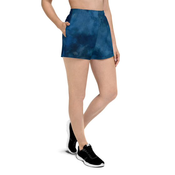 womens watercolor blue shorts with pockets on a woman in tennis shoes from river to ridge brand