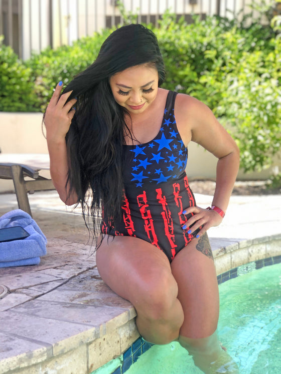 One Piece 2A Gun Flag Patriotic Swimsuit with Tactical Pattern from River to Ridge on a woman at the pool