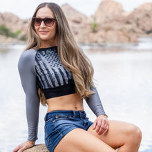  Athletic Woman in Patriotic Grey and Black Flag Crop Top at Lake in Arizona in jean shorts for River to ridge brand