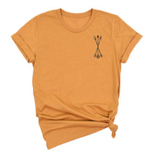  yellow mustard t-shirt with a small graphic of archery arrows on a white background