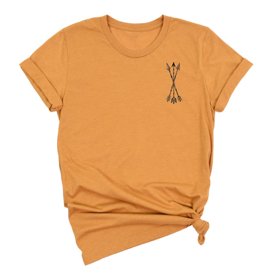 yellow mustard t-shirt with a small graphic of archery arrows on a white background