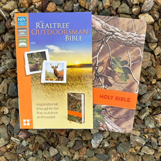 Realtree Outdoorsman Bible on a stone surface