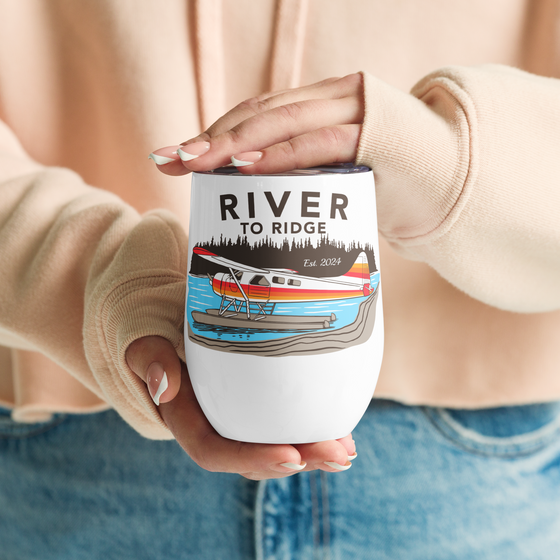 Insulated wine tumbler with lid from River to Ridge Brand with a Alaska bush plane logo, otter on it on floats at the lake- Backcountry Taxi