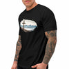 Black t-shirt with a cross and mountain design worn by a person with tattoos for River to Ridge Clothing.