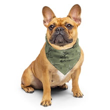  Dog wearing a green bandana on a white background