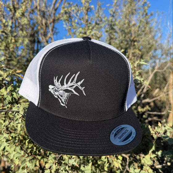 Black and white cap with a elk antler design on a natural background