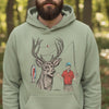 Man wearing a light green hoodie with a deer and fishing design in a forest setting