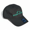 Black cap with 'River to Ridge' logo on a gravel surface