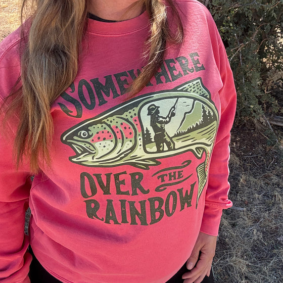Product mockup of a River to Ridge Clothing Brand Somewhere Over the Rainbow Womens Trout fishing Pullover sweatshirt with a woman fishing inside a rainbow trout drawing.